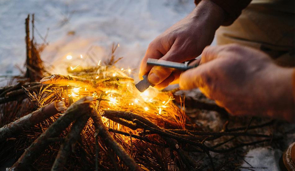 Minimalist bushcraft shelter made from branches and leaves